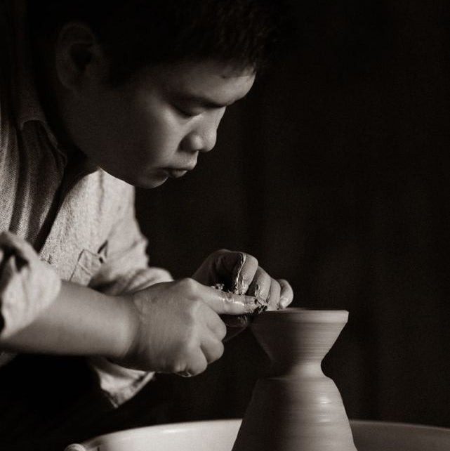 Artist Zhuchen is working on his pottery at the moment